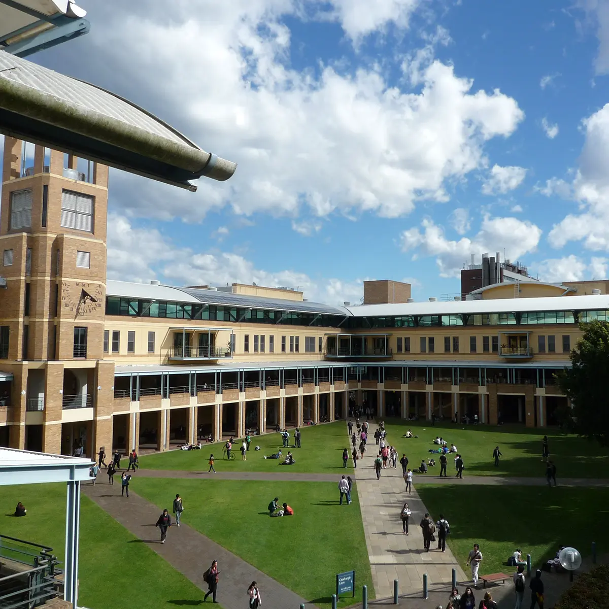 Courtyard surrounded by a modern multi-storey building, illustrating potential mobile coverage challenges in urban environments.
