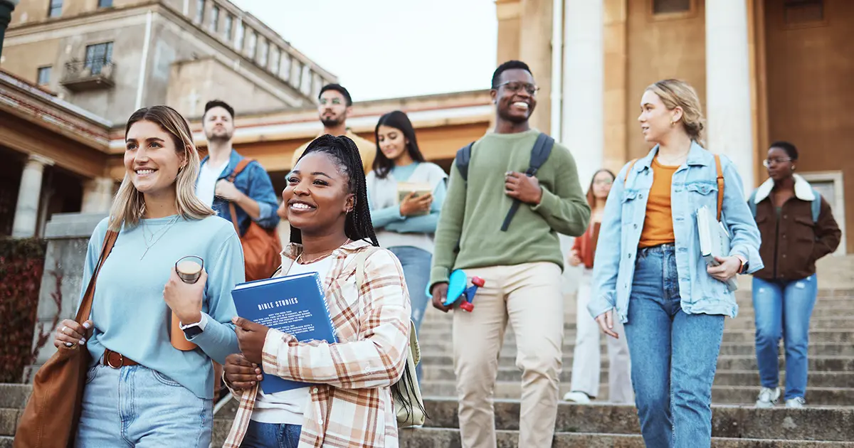 Group of students on a university campus, illustrating the need for integrated two-way radio systems to support safety and incident coordination.