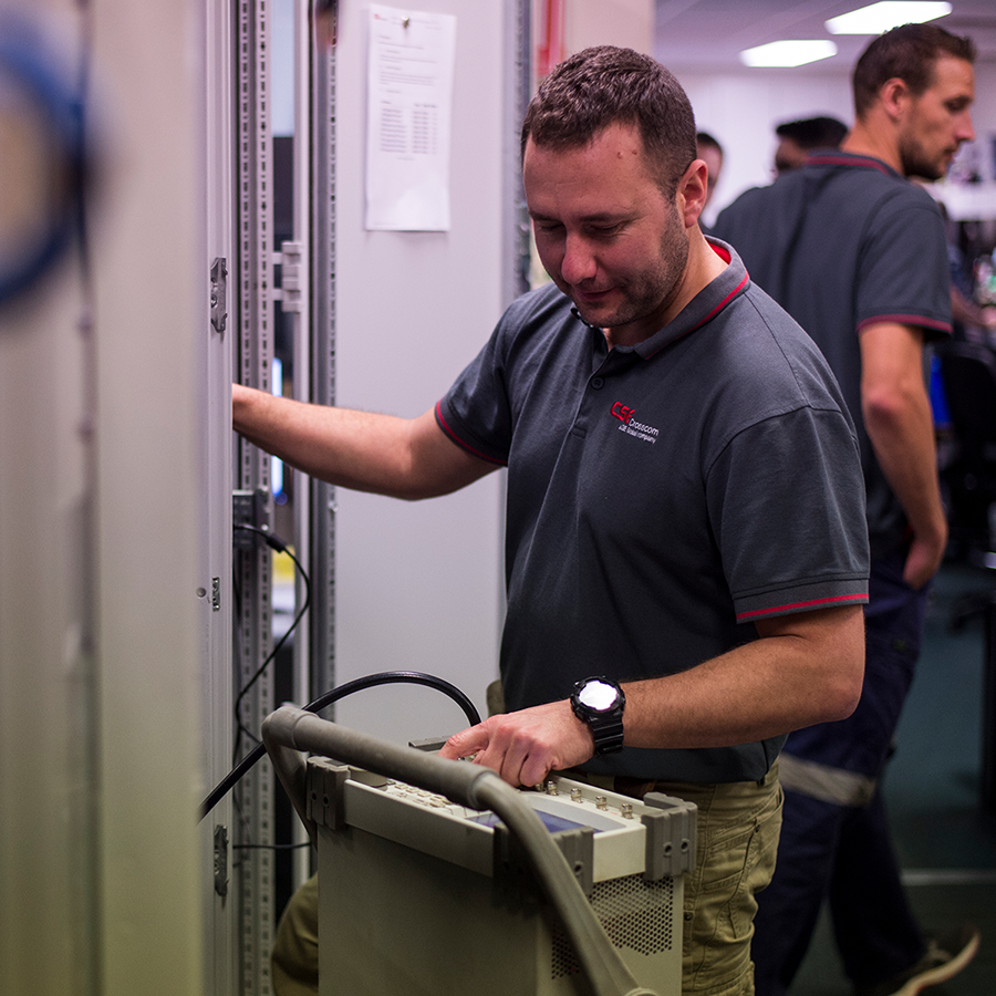 CSE Crosscom technician is in the process of installing and programming a complex communication solution.