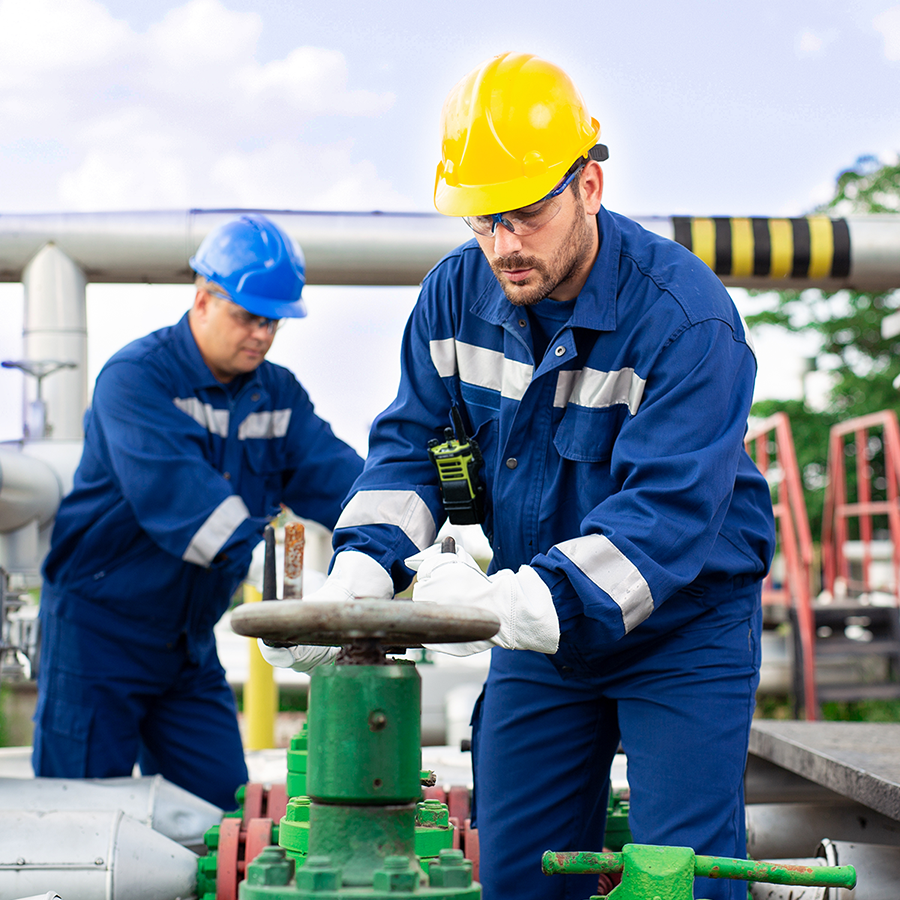 Two utilities workers use a CSE Crosscom communication system to perform inspections