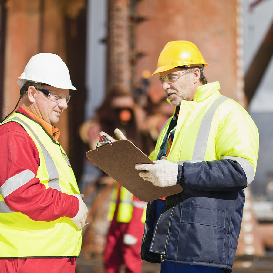 Two workers wear utilities site PPE