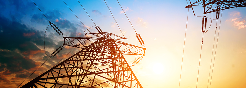 CSE Crosscom Communication Tower backlit by a sunset