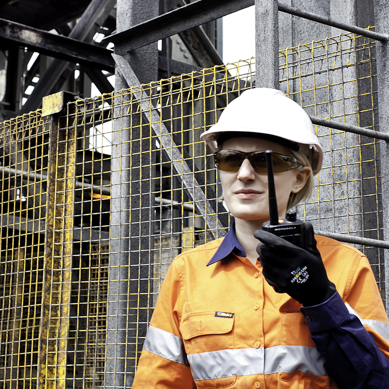 Miner uses a hired Motorola Solution's two-way radio to connect with her team.