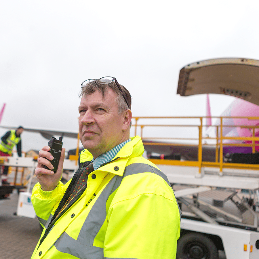 Air traffic staff uses a Motorola Solution's two-way radio to communicate with the control tower on tarmac conditions.