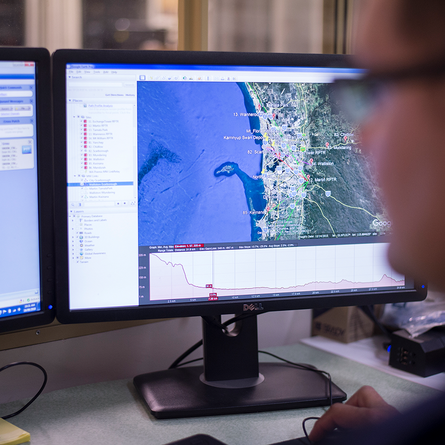 CSE Crosscom team member views a coverage map on a computer.